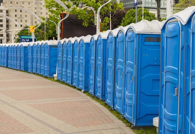 a row of portable restrooms at a fairground, offering visitors a clean and hassle-free experience in silvertown